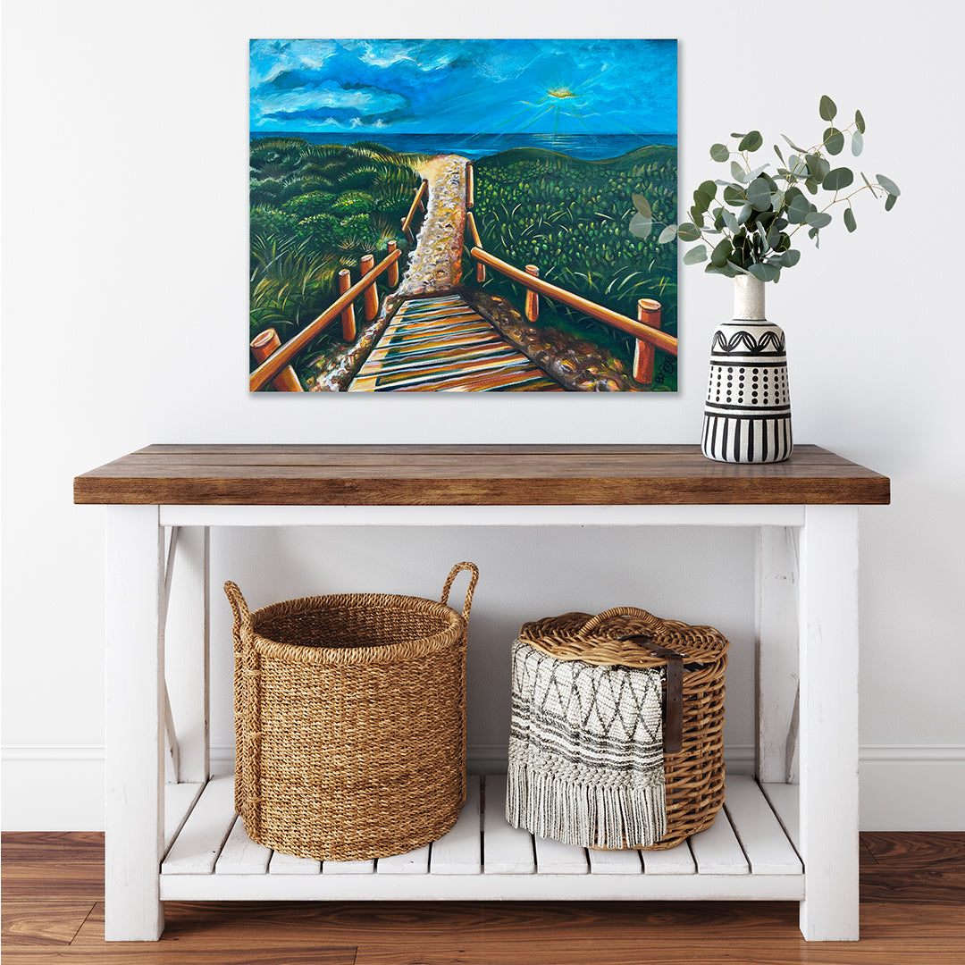 Room mock-up of West Coast Winter by Brigitte James above a wooden console table with a vase and woven baskets.